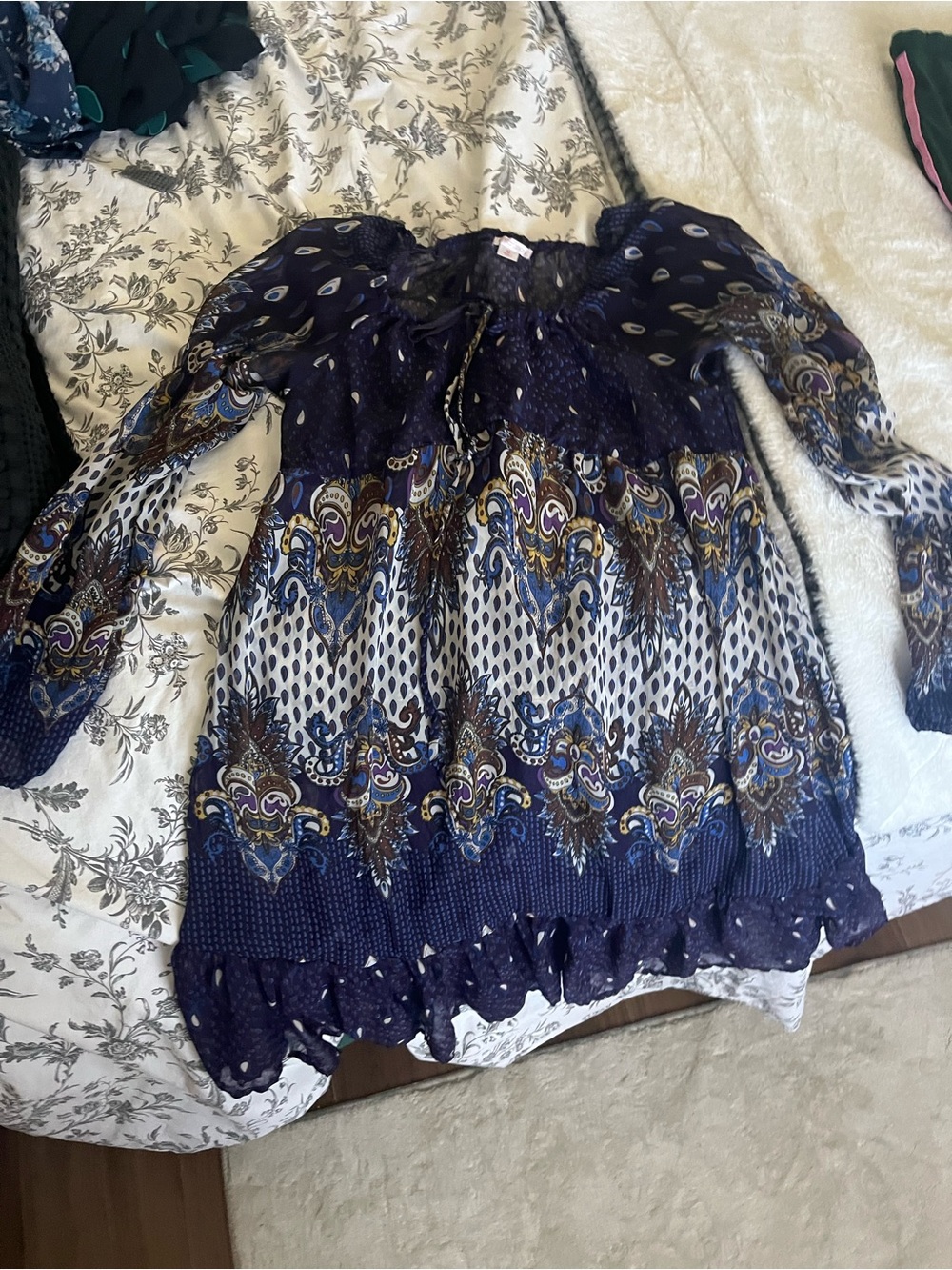 Babydoll dress in light flowy material adjustable tie neck